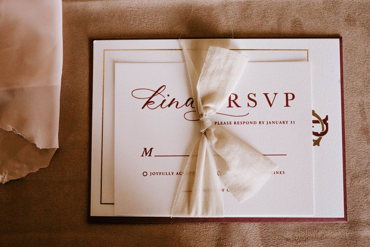 Wedding Stationery — Landing Page Top view of wedding invitation card for guest with RSVP abbreviation requiring respond from invitee